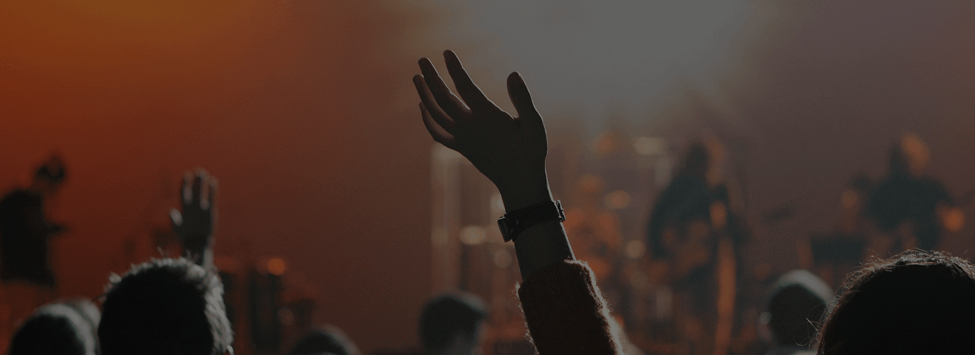 Close up shot of a girl raising her hand in air